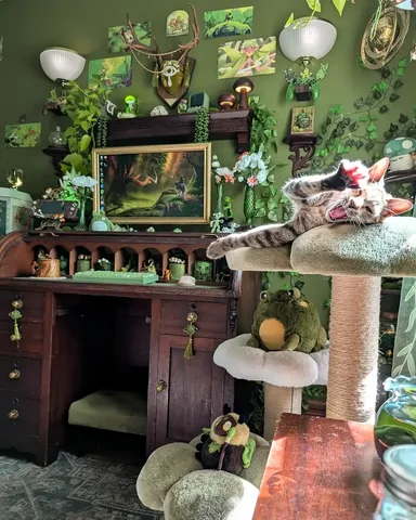 cozy.goblin.gaming Instagram post about Cats in a gaming room