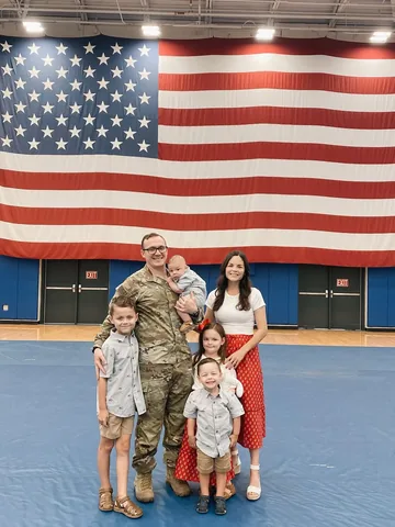 cradlecatholicmom Instagram post about Family reunion after deployment