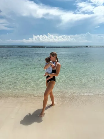 fashionambitionist Instagram post about Postpartum family vacation