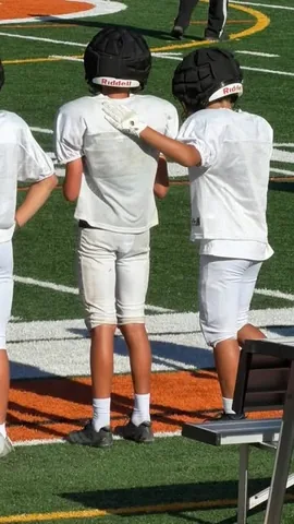 mommasgonecity Instagram post about Youth football participation