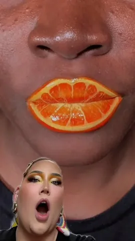 nikkietutorials Instagram post about Orange lip makeup