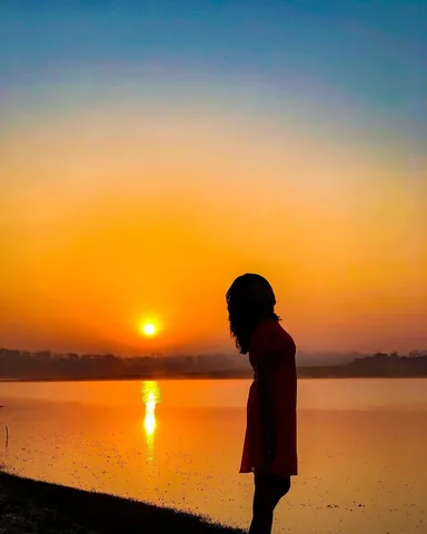 travelmynation Instagram post about Sunset reflection