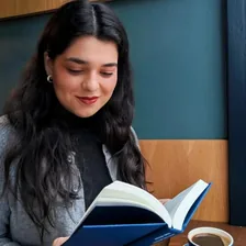 Ula, in a library — Instagram profile photo